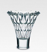 A beautiful crystal vase is handcrafted with a smooth base and diamond-cut facets along the wide, open neck. From the Tornado Collection Full-lead crystal 10 high Hand wash Made in France 