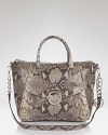 Make an exotic statement with this snake-embossed leather satchel from MICHAEL Michael Kors. In a versatile shape, this serpentine style goes from work to weekends without a sartorial slip.