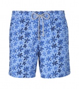 A brand original style since the 70s detailed with a small tropical floral print, Vilebrequins Moorea swim trunks are as fun as they are iconic - Waterproof elastic waistband, back flap pocket, side slit pockets, back eyelets for release of water, durable drawstring cord with stainless metal aglets, interior cotton briefs - Classic slim fit - Wear in the water, or post-swim with a polo and flip-flops - Comes with a logo printed drawstring pouch