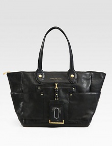 A chic and roomy style in luxurious leather, perfectly sized for all your essentials.Double shoulder straps, 9 dropTop zip closureDetachable luggage tagThree outside open pocketsOne inside zip pocketTwo inside open pocketsFully lined12¾W X 10H X 6DImported