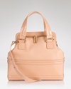 Upgrade wardrobe staples with Z Spoke Zac Posen's leather tote. Designed to meet daytime demands, this boxy bag shines with tailored separates and a take-charge attitude.