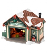 Before they hit the road this Christmas, Snow Village residents will get their cars checked out at the local family-run place, Grandpa's Garage. Traditional garland and a fresh dusting of snow give it a festive touch.