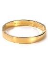 Understated alone and statement making when stacked. kate spade new york's engraved gold-plated bangle gives every look the Midas touch.