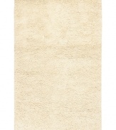 Step onto a cloud-soft area rug in rich, felted ivory wool. Offering one of the thickest, plushest hands in the industry, the Surya Metropolitan area rug billows with softness in every space.