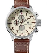 Deck yourself out with dateless style. This Tommy Hilfiger watch features a brown leather strap and round stainless steel case. Ivory dial with brown numerals, logo, date window and three subdials. Quartz movement. Water resistant to 50 meters. Ten-year limited warranty.