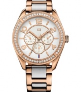 A sporty silhouette flaunts rosy color and sparkling accents on this Tommy Hilfiger watch.