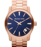 A blue dial adds allure to this rosy Runway watch from Michael Kors.