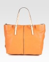 A perfect blend of beauty and functionality, this roomy design is crafted from sumptuous leather with contrast trim. Adjustable double top handles, 3¾-9½ dropAdjustable shoulder strap, 20½-21 dropTop zip closureOne inside zip pocketTwo inside open pocketsFully lined14½W X 12H X 6DMade in Italy