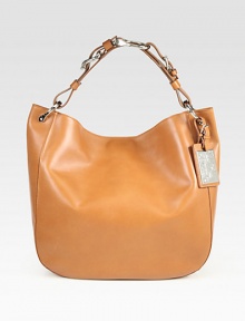 This easy silhouette of butter-soft leather is upgraded with an equestrian-inspired handle and iconic luggage tag. Adjustable chain and leather shoulder strap, 4¾-5¼ dropMagnetic top closureLogo-embossed metal luggage tagOne inside zip pocketTwo inside open pocketsCotton lining12W X 12½H X 4¾DMade in Italy This easy silhouette of butter-soft leather is upgraded with an equestrian-inspired handle and iconic luggage tag. Adjustable chain and leather shoulder strap, 4¾-5¼ dropMagnetic top closureLogo-embossed metal luggage tagOne inside zip pocketTwo inside open pocketsCotton lining12W X 12½H X 4¾DMade in Italy