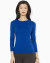 A lustrous silk and cashmere construction lends sultry appeal to a classic crewneck sweater.