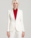 An ivory Rachel Zoe suit jacket polishes your look with elegance and sophistication, perfect for cocktail parties and special events when paired with matching skinnies and dramatic platforms.