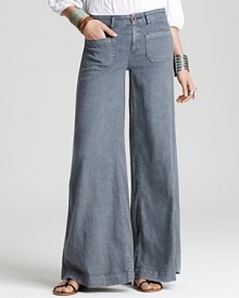 Free People's ultra-wide leg jeans play up the '70s trend with abandon boasting front and back patch pockets for a truly retro look. Free People's ultra-wide leg jeans play up the '70s trend with abandon boasting front and back patch pockets for a truly retro look.
