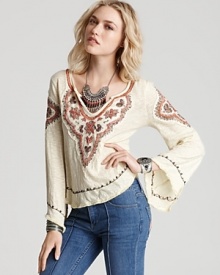 You'll be on the fringe in this boho-luxe Free People top designed with a keyhole neckline, intricate embroidery and bell sleeves. Keep things hippie-chic and pair the piece with your favorite flares.