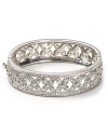 Say I do to sparkle. With a floral design and inset crystals, Carolee's silver bangle vows to wow.