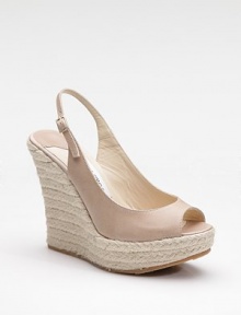 A rich leather style with multiple personalities - part slingback, part espadrille, part sandal - all on a platform wedge.Rope-covered wedge, 5 (125mm) Covered platform, 1¾ (45mm) Compares to a 3¼ heel (80mm) Leather upper Open toe Adjustable buckle slingback Leather lining Padded insole Rubber sole Made in ItalyOUR FIT MODEL RECOMMENDS ordering one half size up as this style runs small. A rich leather style with multiple personalities - part slingback, part espadrille, part sandal - all on a platform wedge.Rope-covered wedge, 5 (125mm) Covered platform, 1¾ (45mm) Compares to a 3¼ heel (80mm) Leather upper Open toe Adjustable buckle slingback Leather lining Padded insole Rubber sole Made in ItalyOUR FIT MODEL RECOMMENDS ordering one half size up as this style runs small.