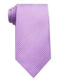 Adding some visual depth to a monochromatic tie, this printed pattern easily complements a solid tailored shirt. Adding some visual depth to a monochromatic tie, this printed pattern easily complements a solid tailored shirt.
