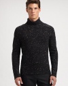 Speckled tweed lends an extraordinary finish to a cold weather classic, shaped in pure merino wool.Ribbed knit collar, cuffs and hemMerino woolHand washImported