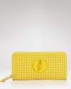 Punch up your practical portfolio with this perforated leather wallet from Juicy Couture. Slipped form an it bag, it will lend instant cool.