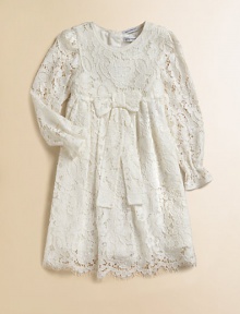Nothing's lovelier for your young lady than the airy swirls of this lavish lace frock with a flowing skirt and a scalloped hem.Round necklineLong sleeves with ruffled cuffsEmpire waist with bowBack button closeSilk/cotton liningRayon/cotton/nylon/silkDry cleanImported Please note: Number of buttons may vary depending on size ordered. Nothing's lovelier for your young lady than the airy swirls of this lavish lace frock with a flowing skirt and a scalloped hem.Round necklineLong sleeves with ruffled cuffsEmpire waist with bowBack button closeSilk/cotton liningRayon/cotton/nylon/silkDry cleanImported Please note: Number of buttons may vary depending on size ordered.