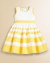 Sunny stripes on crisp cotton gradually get wider as the pretty skirt gets fuller.Round neckline with contrast bandSleevelessFitted bodiceContrast waistband ties in backBack buttonsFull skirtCotton liningCottonMachine washImported Please note: Number of buttons may vary depending on size ordered. 