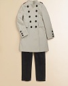 Military details are both sophisticated and feminine in this tailored trench with check trim.Stand collarShoulder epauletsLong sleeves with button cuffsDouble-breasted button frontFront flap pocketsBack half beltBack inverted pleats for fullness97% cotton/3% elastaneDry cleanMade in Italy Please note: Number of buttons may vary depending on size ordered. 