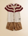 Rendered in a classic crochet design, this cozy, stylish knit with bold touches of color is extra special.ScoopneckShort sleevesButton frontCottonDry cleanImported Please note: number of buttons may vary depending on size ordered. 