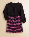 Elegant Italian ponte knit bodice tops lustrous cotton sateen skirt in a vibrant zigzag print.Band collar Bow detail at waist Long sleeves with button cuffs Back zipper 97% cotton/3% spandex Dry clean Made in USA of imported fabric