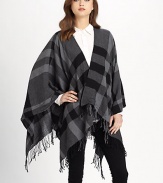A check design with a fringe trim. Open front Extra fine wool About 26 from should to hem Dry clean Imported 