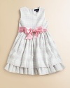 A charmingly traditional dress in multi-striped cotton seersucker has a pretty, full skirt with a petticoat and ribbon sash.ScoopneckSleevelessBack buttonsGathered empire waist with sash tieFull skirt with ruffled petticoatRuffled hemFully linedCottonMachine washImported Please note: Number of buttons may vary depending on size ordered. 