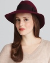 A wool floppy fedora with a soft silhouette and grosgrain bow band accent presents girlish style with a little edge.