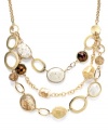 A natural delight! Alfani's stunning swag necklace makes a statement with three rows of polished agate, acrylic beads and composite shells. Set in gold-plated mixed metal. Approximate length: 26 inches + 4-inch extender. Approximate drop: 7-1/2 inches.