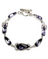 Glamorously girly. Givenchy's stunning flex style features teardrop-shaped violet crystals with flecks of pale pink crystals. Set in silver tone mixed metal. Approximate length: 7-1/4 inches.