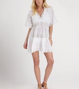 A delicate design with a ultra-feminine neckline and a flattering fit, thanks to its waist-accentuating, self-tie front.V-neckShort sleevesSelf-tiePull-on styleScalloped hemCottonHand washImported