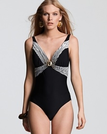 Gottex's v neck one piece boasts flattering cut and elegant detailing. With its notice me neckline, this suit brings a touch of glamour to your bathing look.