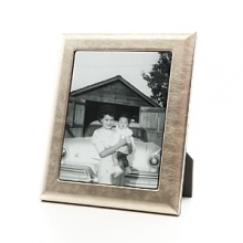Supple fine Italian leather wraps this handcrafted frame in true luxury. A sturdy easel and easy access to photos makes it equal parts form and function. Supple fine Italian leather wraps this handcrafted frame in true luxury. A sturdy easel and easy access to photos makes it equal parts form and function.