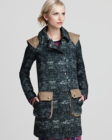 This cotton Gryphon coat in a rich twill is a fashion-forward choice for the new season. Flaunting epaulets, elbow seams, large front pockets a back kick pleat with snap detail, this unique design stands out against ubiquitous trench and pea coat styles. This cotton Gryphon coat in a rich twill is a fashion-forward choice for the new season. Flaunting epaulets, elbow seams, large front pockets a back kick pleat with snap detail, this unique design stands out against ubiquitous trench and pea coat styles.