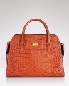 Add exotic allure to your carryall collection with Michael Kors' crocodile leather tote. Shoulder the vivid bag with all-black to tip the scale on day-to-day chic.