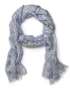 A woven oblong scarf in lilac and celery green leopard print for an edgy yet girlish accessory.