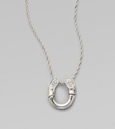 A white sapphire adorned pendant on a delicate chain. White sapphires Sterling silver Length, about 18 Pendant size, about ¾L X ½ W Lobster clasp Imported 