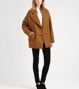 Menswear-inspired coat in an Italian, wool-rich silhouette with dropped shoulders and convenient snap closures. Notched lapelsDropped shouldersLong sleevesFront snap closuresSlash pocketsBack self beltAbout 30 from shoulder to hem75% wool/25% nylonDry cleanMade in ItalyModel shown is 5'10 (177cm) wearing US size 4.
