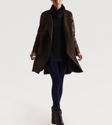 A distinctive wool overcoat styled with rich leather sleeves for a touch of urban chic.Snap-button closureFlat frontShirttail hemAbout 35 from shoulder to hemBody: 90% wool/10% nylonSleeves: lambskinDry clean by a leather specialistImportedModel shown is 5'9 (175cm) wearing US size Small.