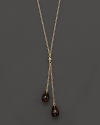 Twin smoky quartz briolettes sparkle from this 14K yellow gold lariat necklace.