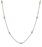 Sparkle by the inch. B. Brilliant's beautiful necklace features seven stations of round-cut cubic zirconias (3/4 ct. t.w.). Set in 18k rose gold over sterling silver. Approximate length: 18 inches.