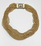From the Modern Classics Collection. Strand upon strand of tiny golden beads are delightfully dramatic in this arresting design with a sparkle turn-lock clasp.GoldtoneLength, about 16Turn-lock claspImported