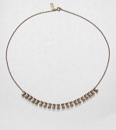 The graphic shape of the ubiquitous push pin forms this witty and chic chain necklace.BrassLength, about 18C-ring claspImported