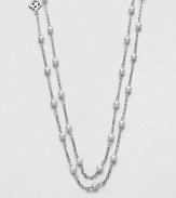 From the Pearl Collection. A graceful chain is delightfully dotted with creamy white pearls in this lovely strand that's long enough to douoble or even knot.3.5mm round white pearlsSterling silverLength, about 60Toggle closureImported