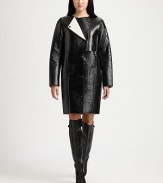 Lustrous, lacquered coat has an asymmetrical overlay, oversized sleeves and a length that hits just above the knee. RoundneckZippered asymmetrical overlayLong sleevesButton frontFront pocketsFully linedAbout 36 from shoulder to hemLacquered 90% cotton/10% viscoseDry cleanImported of Italian fabricModel shown is 5'10 (177cm) wearing US size 2.