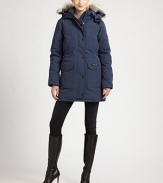 Designed with a woman's body in mind, this duck-feather down coat has storm flaps and a mid-thigh length.