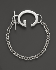 This sterling silver toggle bracelet bears Gucci's signature G. This sterling silver toggle bracelet bears Gucci's signature G.
