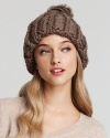 With a thick knit and chubby pompom, this mushroom-styled cap is soft and sweet. By Nobis.